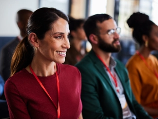 Smiling woman attending a business seminar