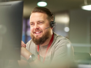 Male IT worker calling a client