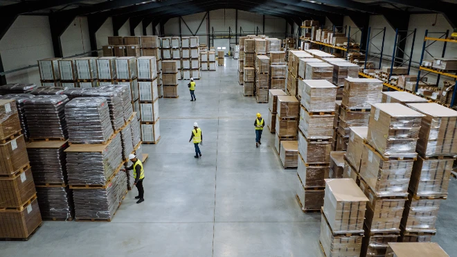 Workers in warehouse with packages