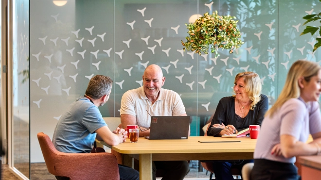 Three colleagues meeting