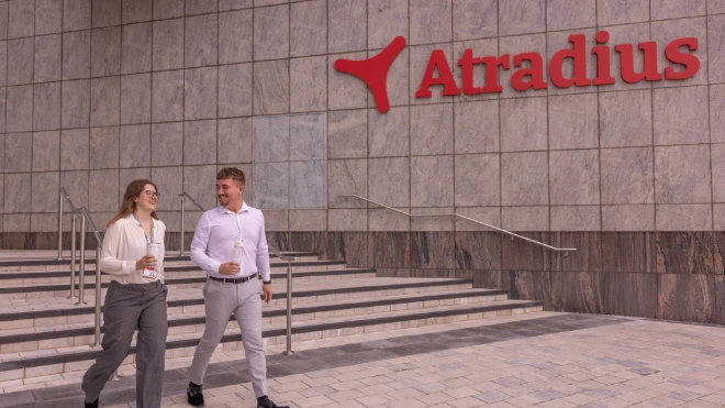 Woman and man going for a walk outside at the entrance of the Cardiff office