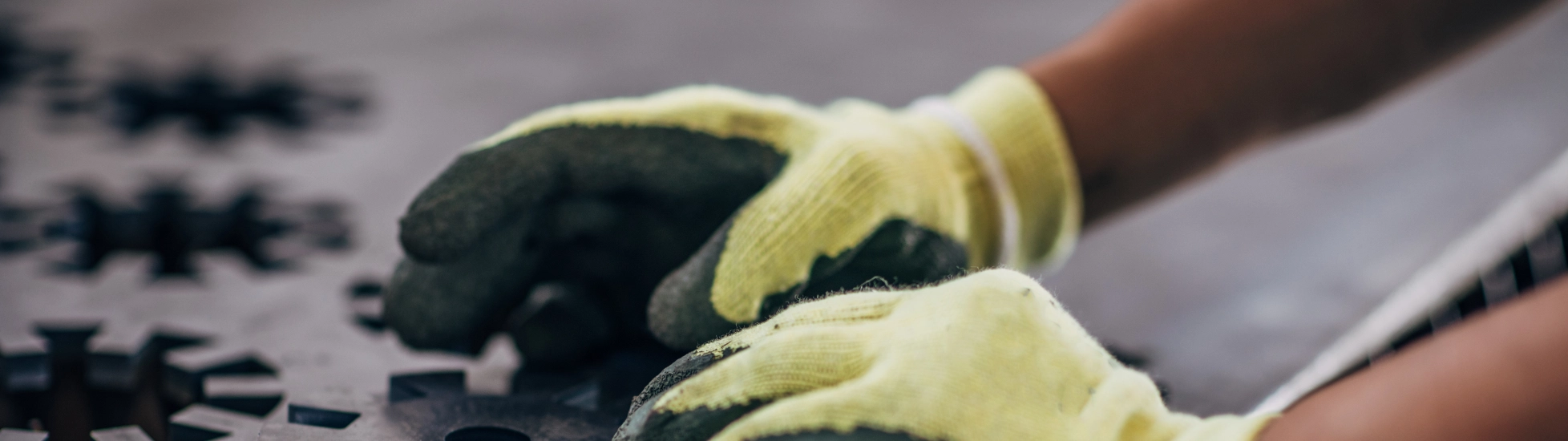 Close up of an engineer forming a metal component