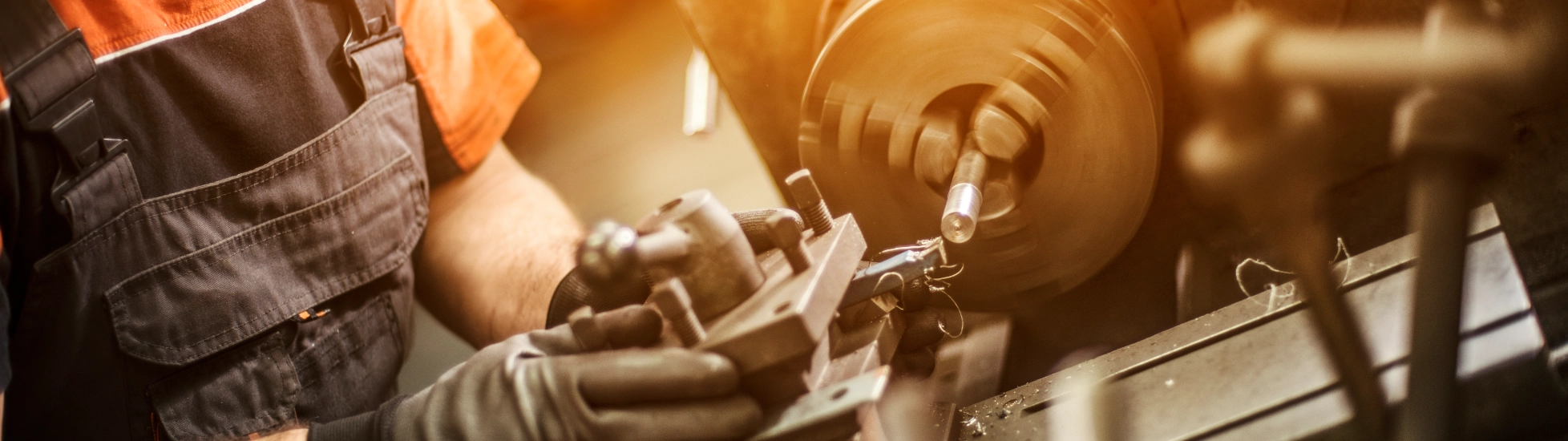 Male engineer drilling machine parts