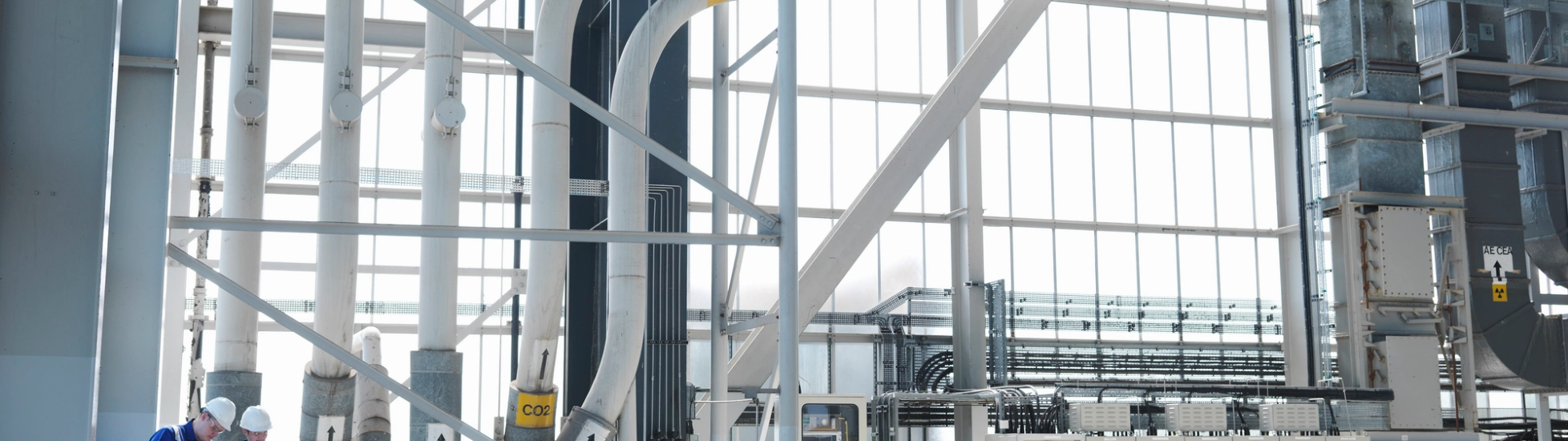 two people in a power charging plant